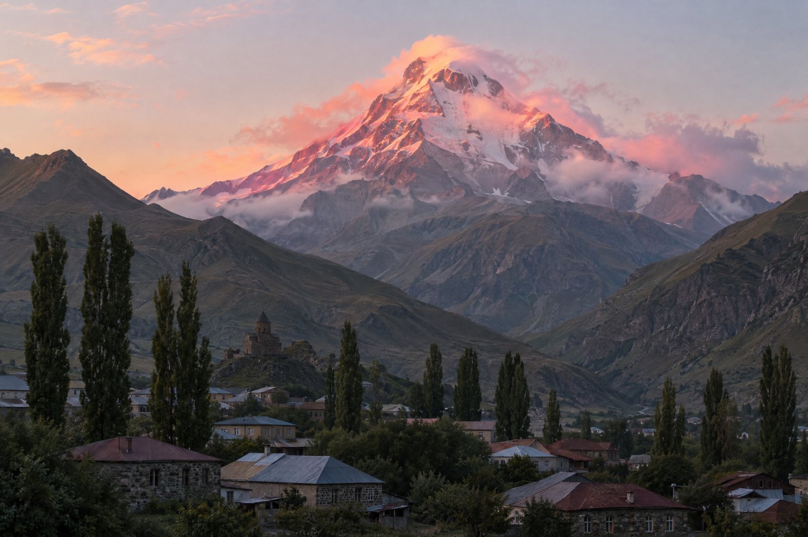 Mount Kazbek at sunrise above Stepantsminda